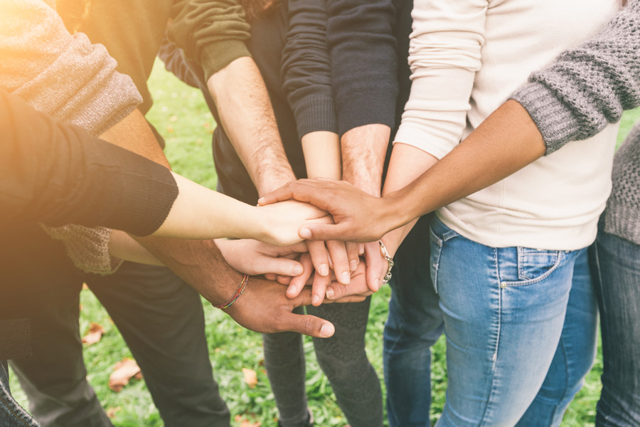 volunteers uniting hands